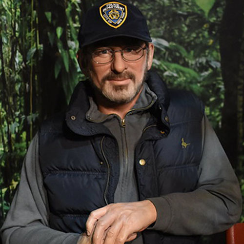 Steven Spielberg on the set of the movie in a cap